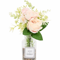 Kunstbloemen in glazen fles