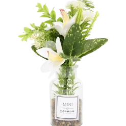 Kunstbloemen in glazen fles